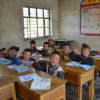We gave each child a notebook and a pencil, and we taught them how to say "goodbye" in Mandarin （再见!)